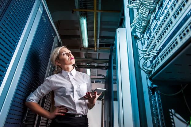 Image of a an IT professional in a server room